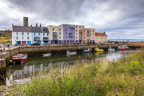 The picturesque harbour and coloured buildings of St Andrews in Fife on the east coast of Scotland.