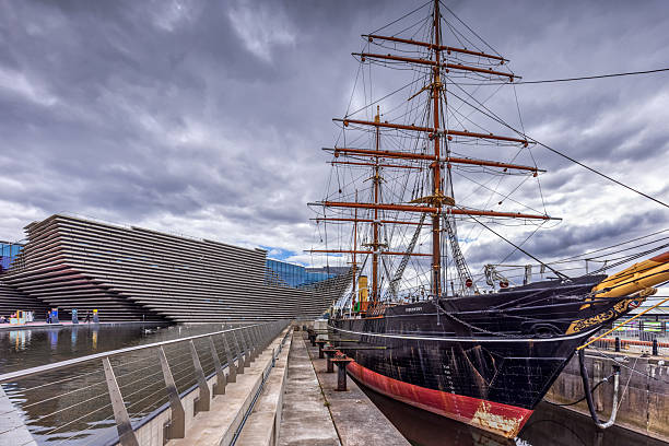 The auxiliary steamship RRS Discovery that took Scott and Shackleton to Antartica in 1901, with the V and A design museum on the Dundee waterfront.
