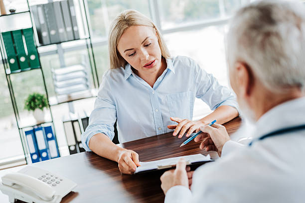 istock Patient discussing concerns with a family practitioner during a medical consultation at a modern and professional clinic. 2237324760