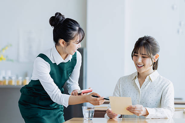 istock A young female waitress taking an order at a cafe 2237324928