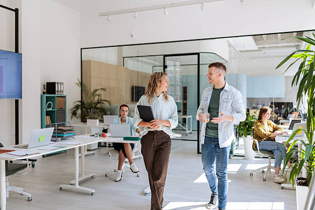 istock Smiling Colleagues Having Casual Talk in Office 2237325046