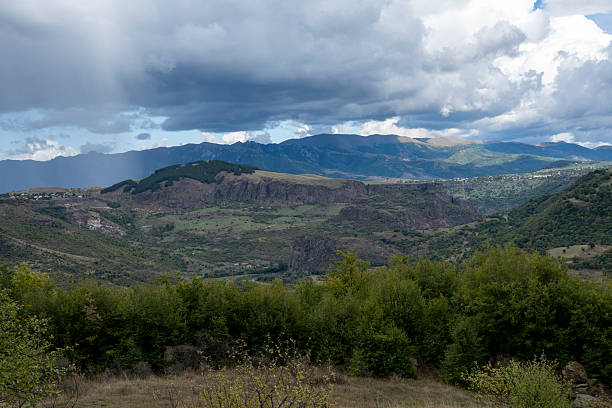 istock Vast Canyon Landscape Surrounded by Rolling Mountains Under Moody Sky 2237325167