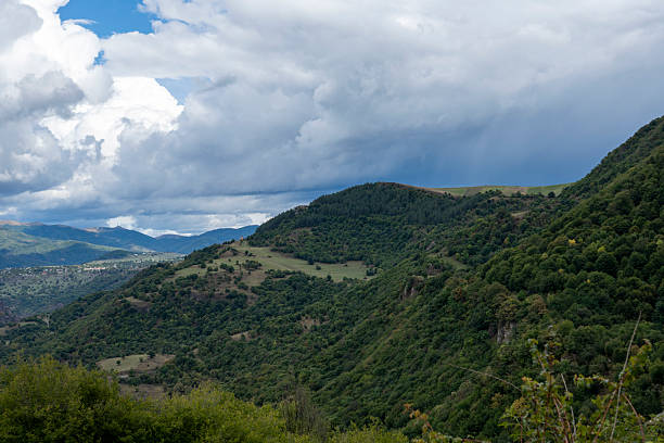 istock Vast Canyon Landscape Surrounded by Rolling Mountains Under Moody Sky 2237325182