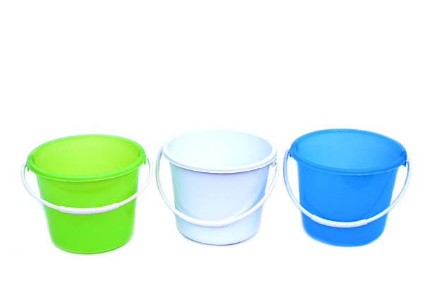 Colorful plastic buckets in green, white, and blue with white handles, isolated on white background. Versatile household containers for water, cleaning, gardening, and daily utility purposes.