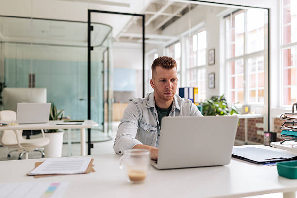 istock Focused Businessman Working on Laptop in Office 2237326869