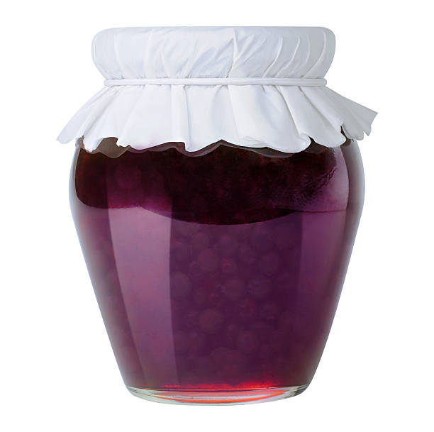 Blueberry jam in a jar closed with paper lid isolated on white background