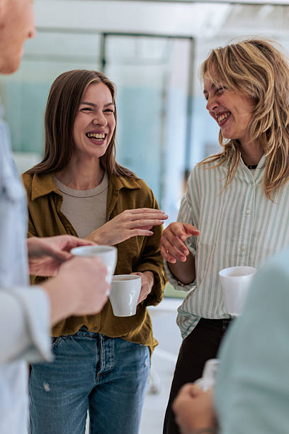 istock Colleagues Enjoying Coffee Break in Office 2237329531