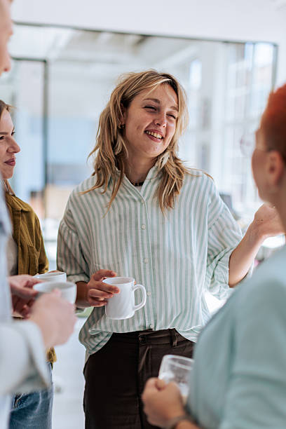 istock Colleagues Enjoying Coffee Break in Office 2237329608