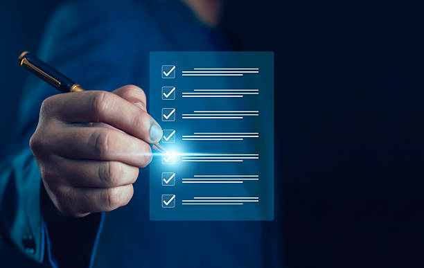 istock Businessman checking digital checklist with pen on virtual screen, symbolizing task management, productivity, efficiency, and modern business technology solutions protection, secure access, digital 2237330454