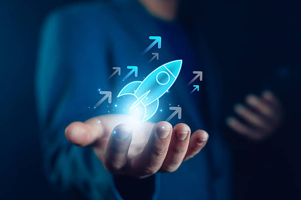 istock Businessman holding glowing digital rocket icon with upward arrows, symbolizing startup growth, innovation, entrepreneurship, success, and future business opportunities symbolizing entrepreneurship, 2237330659