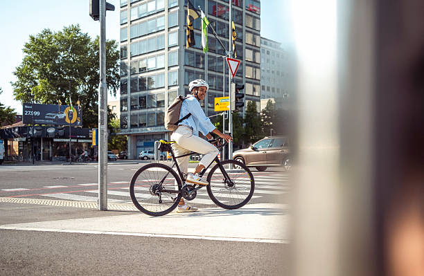 istock Multiracial Female Professional Commuting by Bicycle at Urban Intersection 2237332256