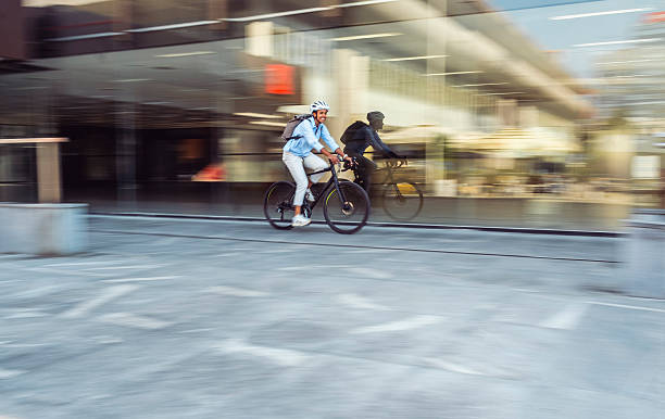 istock Multiracial Female Bicycling to Work in Urban Environment 2237332280