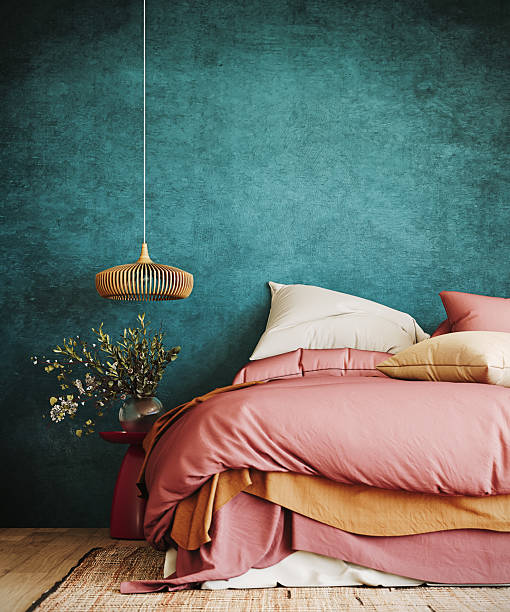 istock Contemporary bedroom design. Colorful bed on vibrant teal wall background with copy space. 2237336876