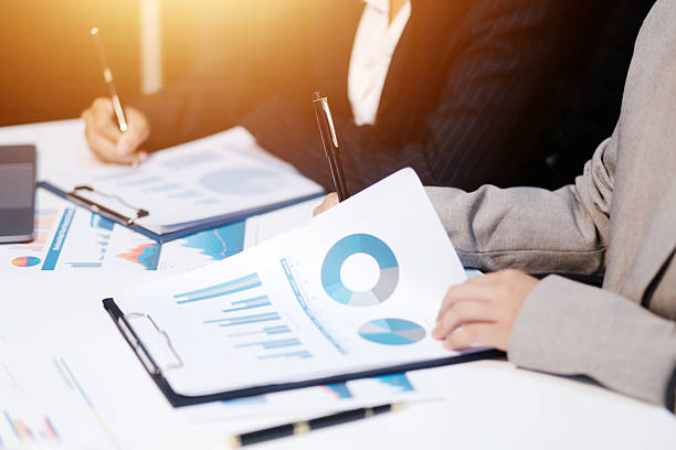 istock Close up of Business team analyzing income charts and graphs with modern laptop computer. Business analysis and strategy concept. 2237337977