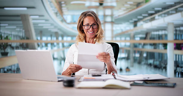 istock Woman Reading Letter From Chartered Accountant 2237337995