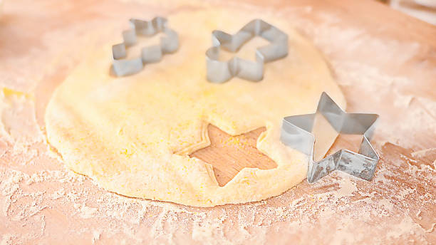 istock Christmas Cookie Dough With Metal Cutters On Floured Surface 2237340489