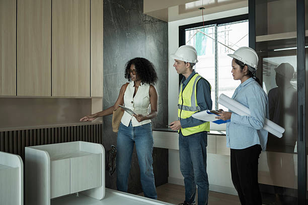 istock Engineer team and client reviewing construction plans inside a modern Bedroom. 2237341055