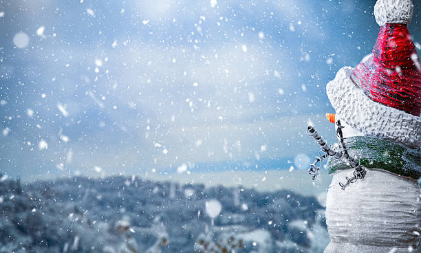 Snowman With Red Hat In Winter Snowfall