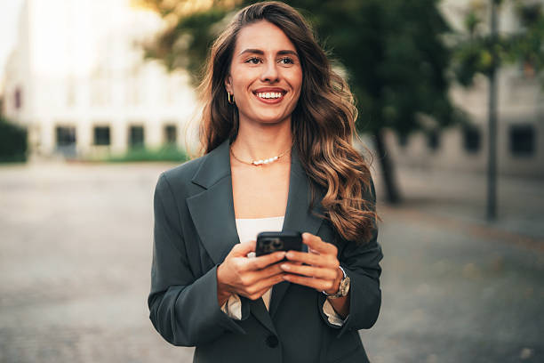 istock Elegant businesswoman using her phone 2237341626