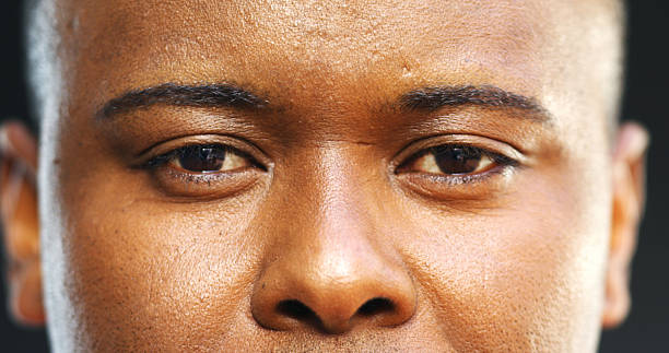 istock Serious, man or portrait with eyes in studio for eyesight, vision or optometry on a dark background. Closeup, male person or model looking with face, optic sight or stare for eyecare or perception 2237341974