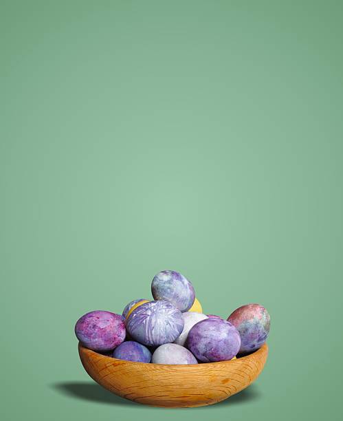 Colorful Easter eggs in a wooden container. Cosmic theme. Pastel colors, blue dominance, minimalist egg decoration