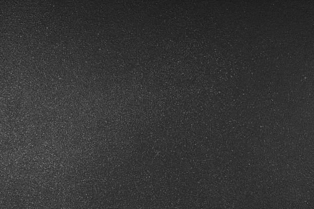 istock Abstract shiny, radiant texture background with of dark gray color, grain textured backdrop 2237348492