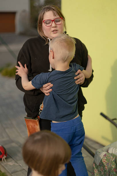 istock An older sister helps her younger brother, reflecting the warmth and support 2237351934