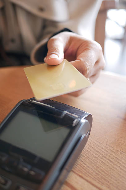 istock Customer making a payment with card at a cafe in the morning 2237352258
