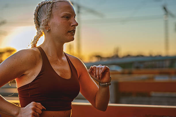 istock Woman jogging on an urban overpass at sunset 2237353327