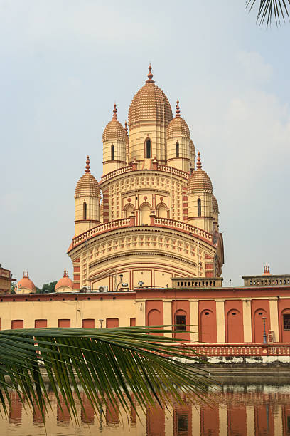 An architectural marvel of Bengal, the Dakshineswar Kali Temple in Kolkata stands as a prominent Hindu pilgrimage site dedicated to Goddess Kali. The iconic nine-spired structure reflects the grandeur of Bengal temple architecture, drawing devotees and visitors seeking spirituality, history, and cultural heritage.