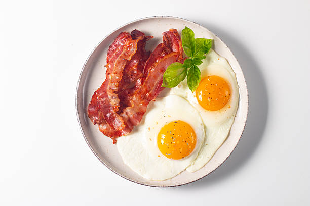 istock Delicious traditional English breakfast with fried eggs and bacon 2237353843