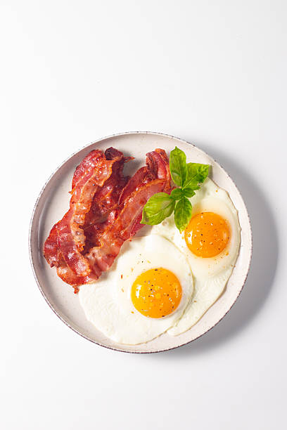 istock Delicious traditional English breakfast with fried eggs and bacon 2237354619