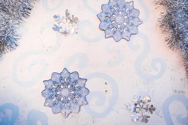istock A white background with two snowflakes and a silver tassel 2237354764