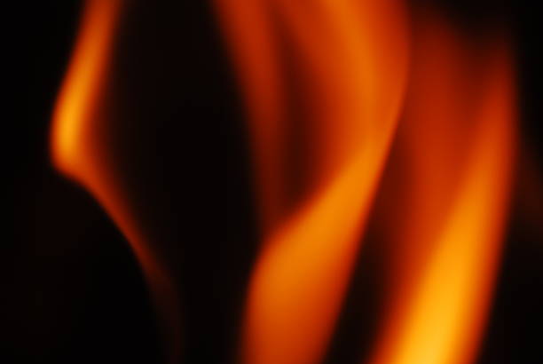 istock Tongues of flame on a dark background 2237355212