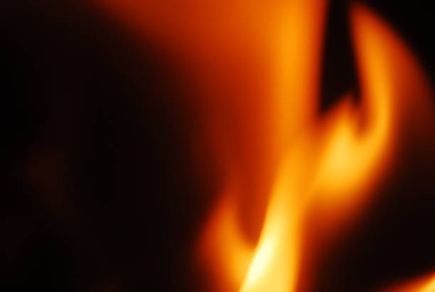 istock Tongues of flame on a dark background 2237355215
