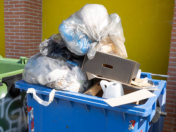istock blue dumpster full of garbage bags, Undifferentiated waste collection 2237356792