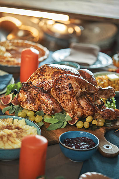 istock Having Stuffed Turkey for Thanksgiving Holiday Dinner with Vegetables, Pumpkin Pie and Side Dishes 2237358293