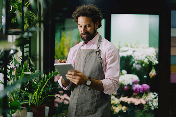 istock Florist Using Tablet to Manage Flower Shop 2237358378