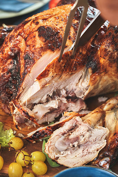 istock Having Stuffed Turkey for Thanksgiving Holiday Dinner with Vegetables, Pumpkin Pie and Side Dishes 2237358446
