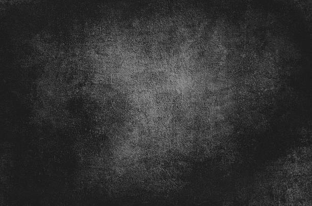 Dark art grunge spooky textured background in black and white colors.