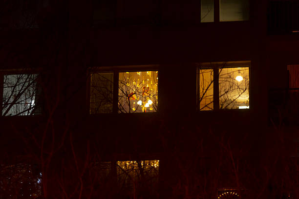 istock The Glow of Illuminated Apartment Windows During the Nighttime Hours 2237366541