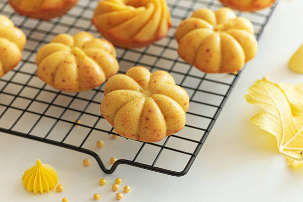 istock Autumn-Themed Mini pumpkin Cakes with Seasonal Decorations on White Background 2237369741