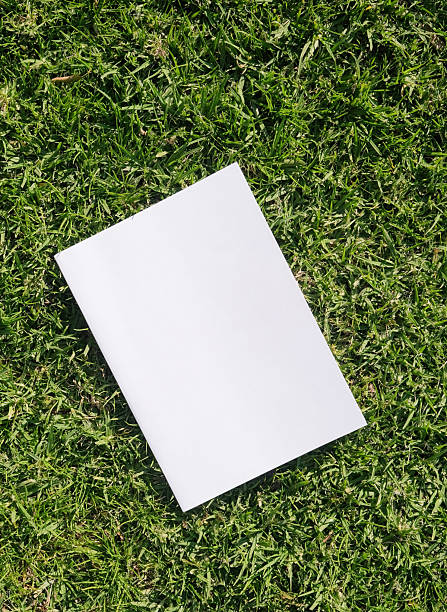 istock Mockup magazine on green grass background 2237369805