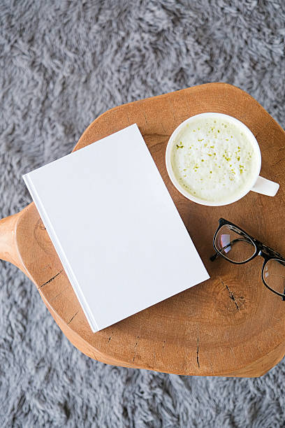 istock blank book mockup on white coffee table with green matcha tea near window 2237370096