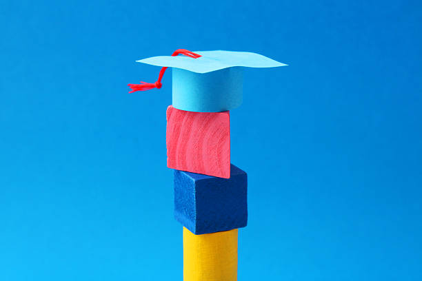 Graduate cap over colorful geometric figures