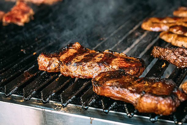istock Ribeye Steak on a Grill at an Argentine Asado 2237381049