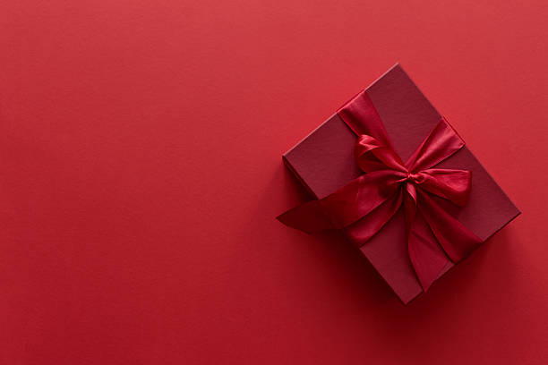 istock Christmas gift on a red background. Top view 2237382105