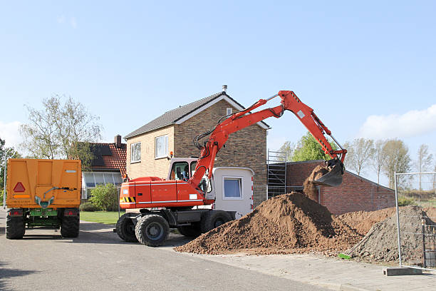 istock a construction site with an excavator and a tipping trailer 2237382149