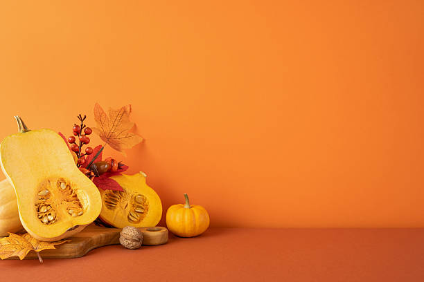 istock Side view of a creative autumn display featuring squash, decorations, and warm Thanksgiving vibes 2237400371