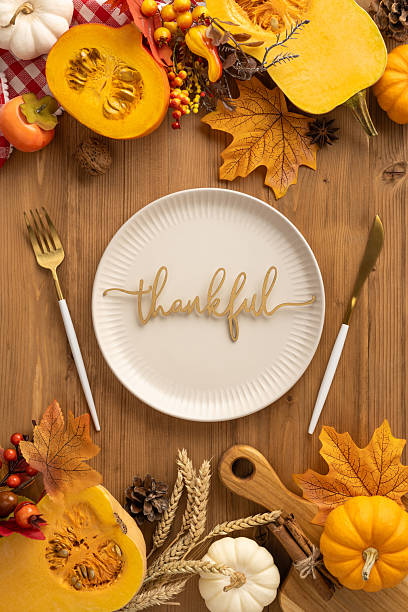 istock Vertical view of a Thanksgiving table setting showcasing harvest elements and festive autumn decor 2237400373